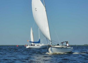 Horizon Cat reaching, with committee boat Whimsy in the background. Horizon Cat Reaching