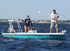 Tarpon fisherman fighting big fish